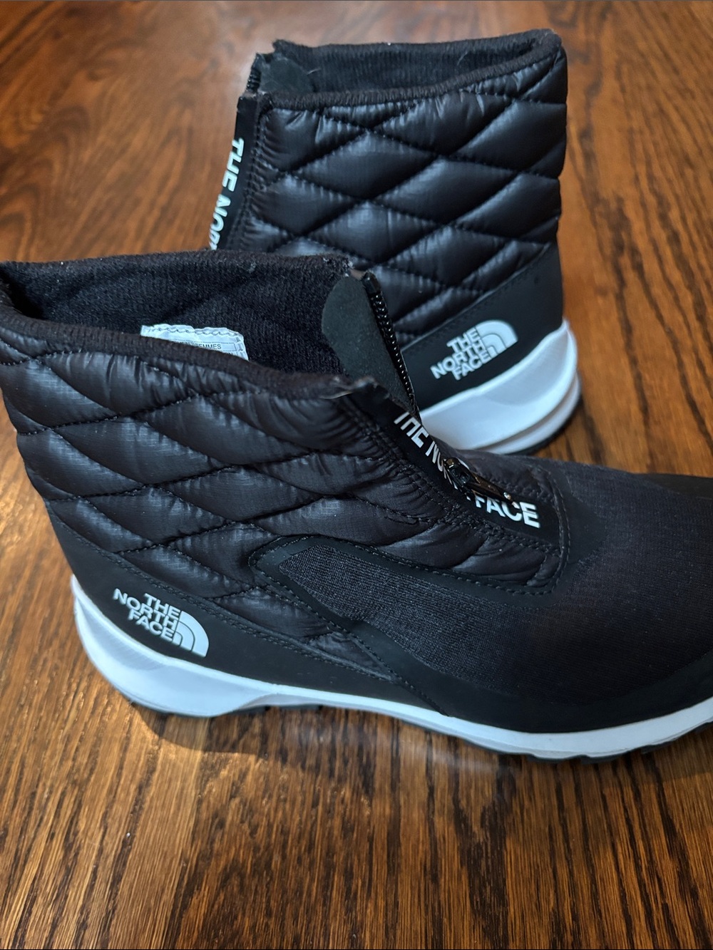 The North Face Black Quilted Ankle Boots with White Soles